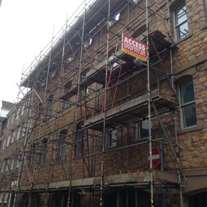 Scaffolding granite building St Helier Jersey