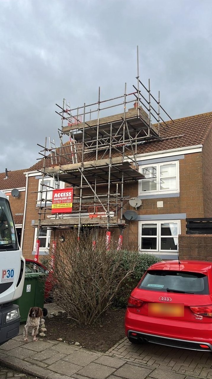 Chimney access scaffolding on a brick house in Jersey