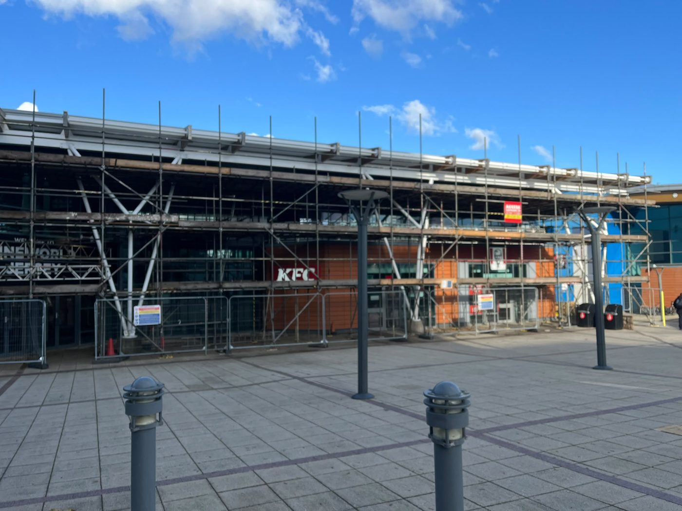 Long run of tube and fitting scaffold across a leisure complex frontage at the St Helier waterfront